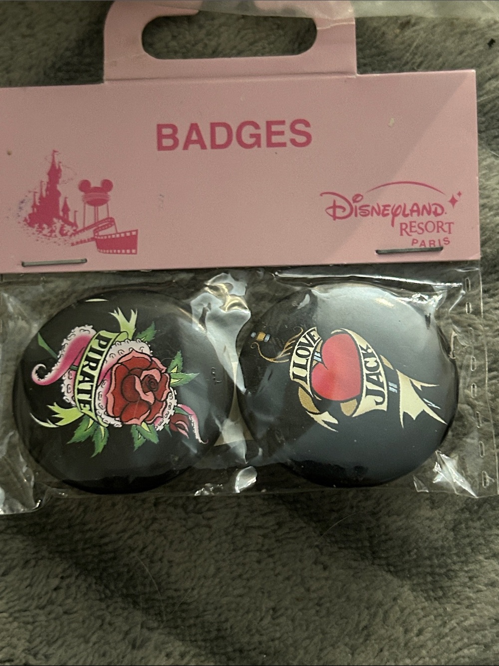Disneyland resort pirates of the Caribbean set of 2 small badges.
